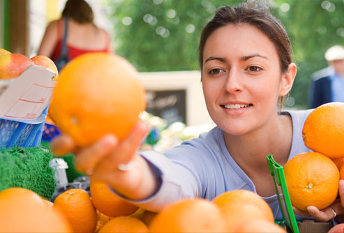getty_rf_photo_of_woman_with_oranges