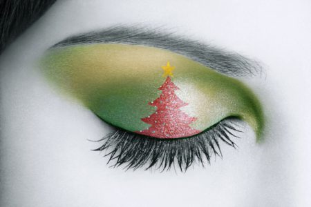 Personnal interpretation of a close-up of a woman eye with a draw of A Christmas three.